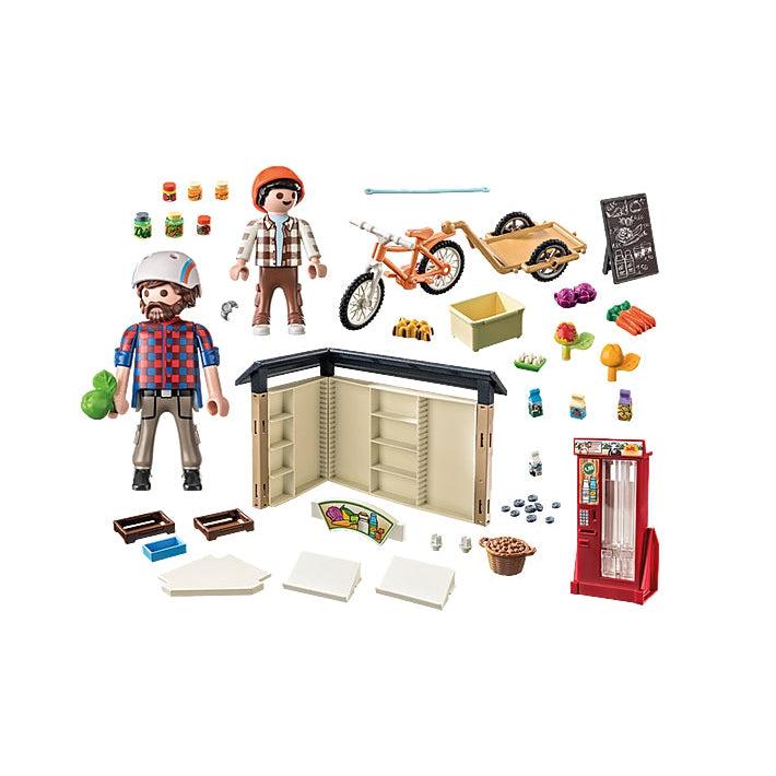 this image shows what is in the box, a bike with a cark, the market stalls, a boy, a man, produce, a sign and plenty of accessories to make the market look lovely. 