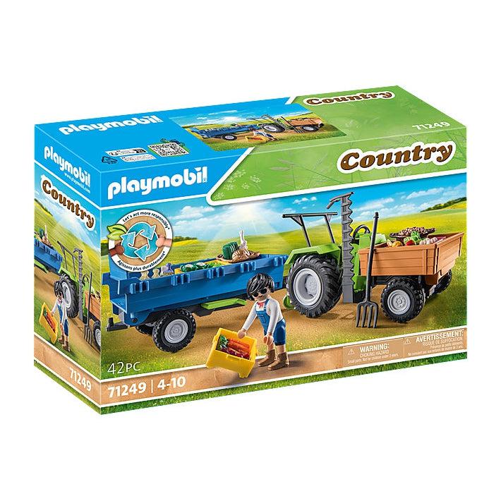 This picture shows the box of the toy. there is a man with his tractor and trailer, getting food ready to go to the farmers market nice and fresh. 