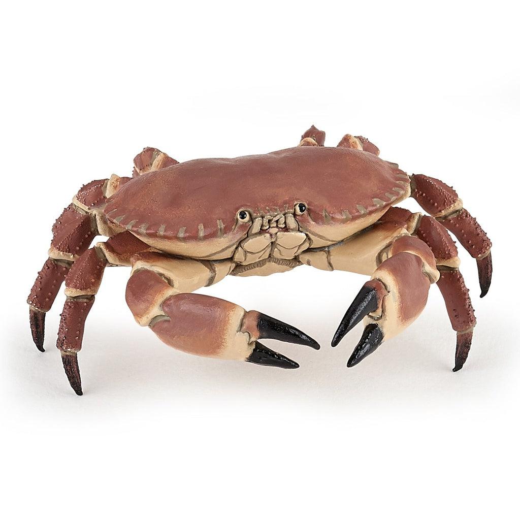 Image of the Crab figurine. It is a realistic looking crab with a red top and a tan underbody. The tip of its legs and claws are black.