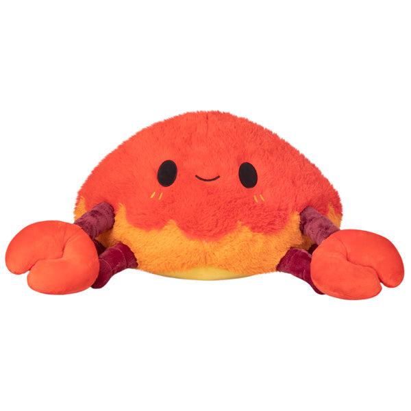 Image of the Crab squishable. It is a red, maroon, and orange crab plush with large front claws.