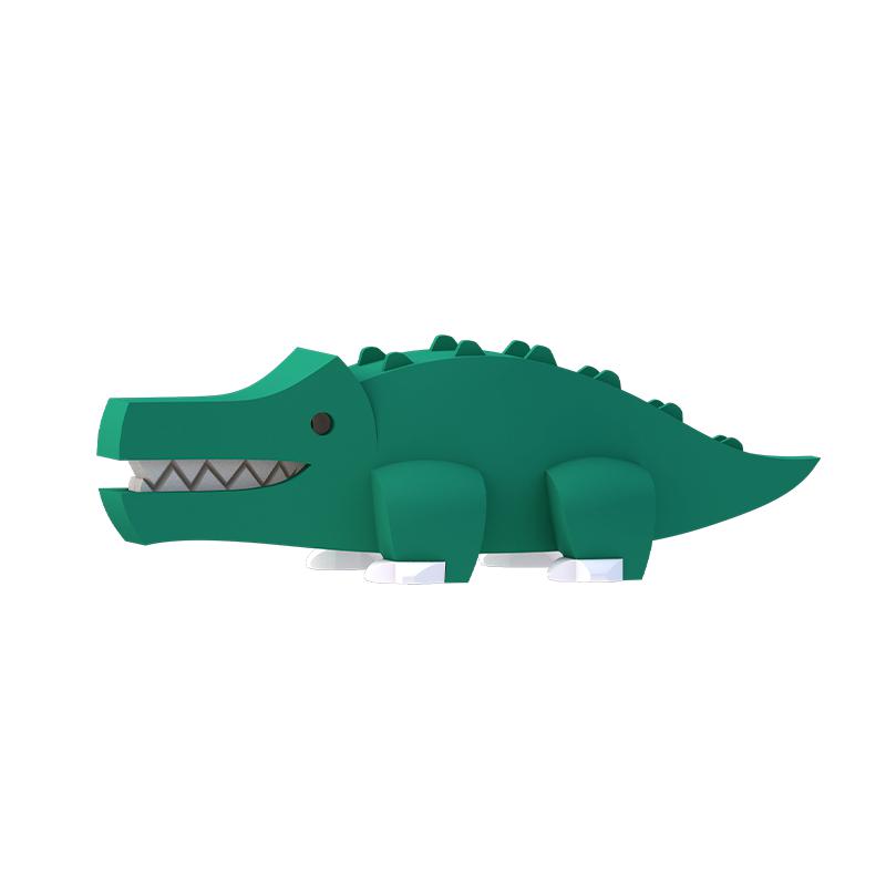 Image of the Crocodile figurine. It is a dark green geometric crocodile. It has small bumps running along the ridge of its back and its mouth is slightly open so you can see its sharp teeth inside.