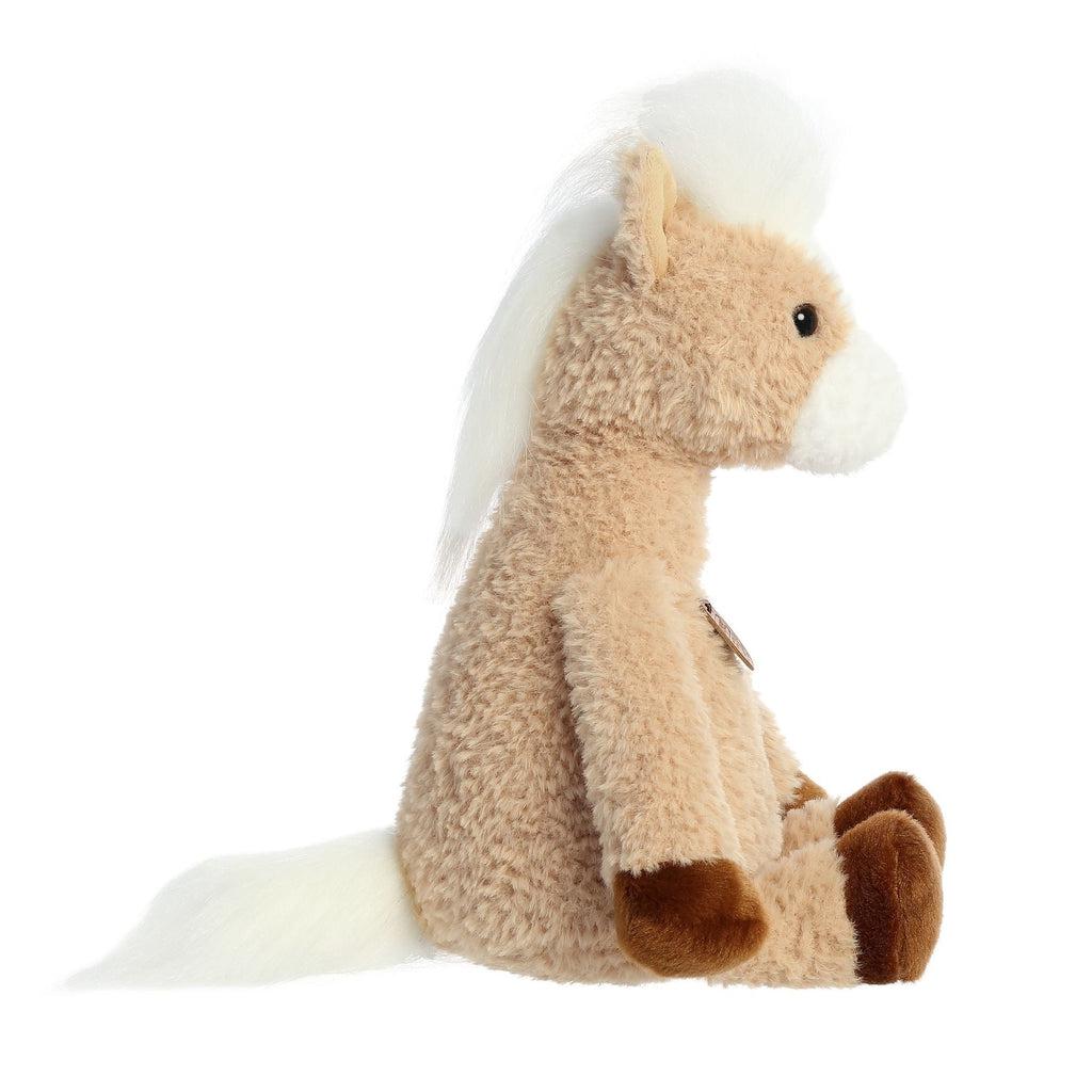 Side view of the plush. Shows that there is a white tail in the back that is about as long as the plush's torso.