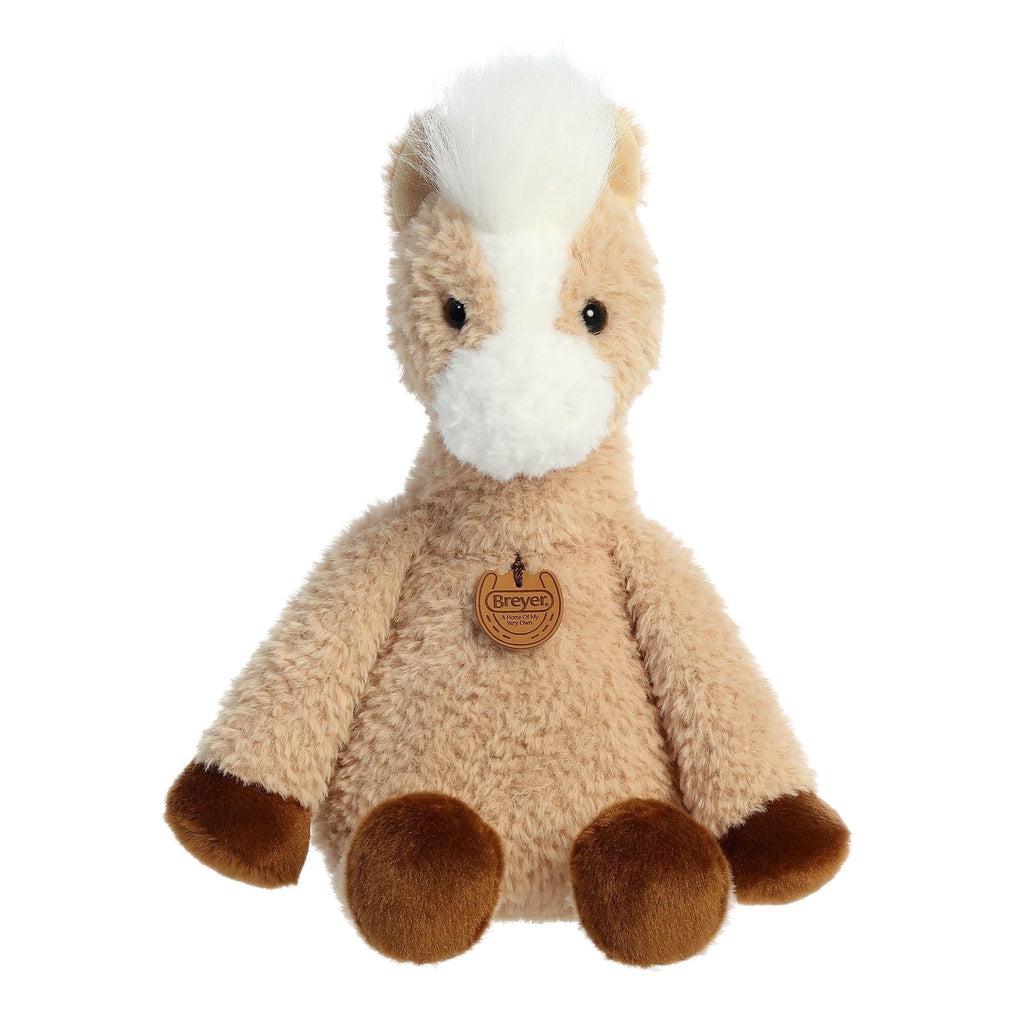 Image of the Cuddle Buddies Clover plush. The horse is tan with brown hooves and a white face, mane, and tail. The body of the horse is very soft and fluffy.