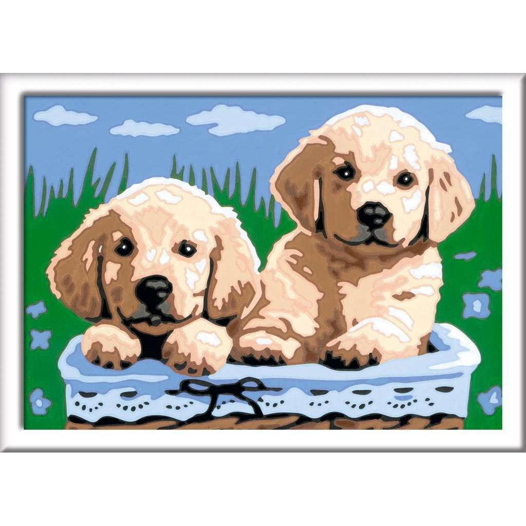 the finished product of cute puppies in a blue basket, durrounded by blue butterflies in some tall grass