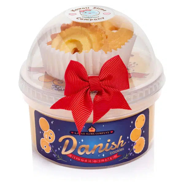 Image of the Danish Butter Cookies Butter Slime in its packaging. It comes in two interlocking containers with one holding the slime and the other holding the included charms.
