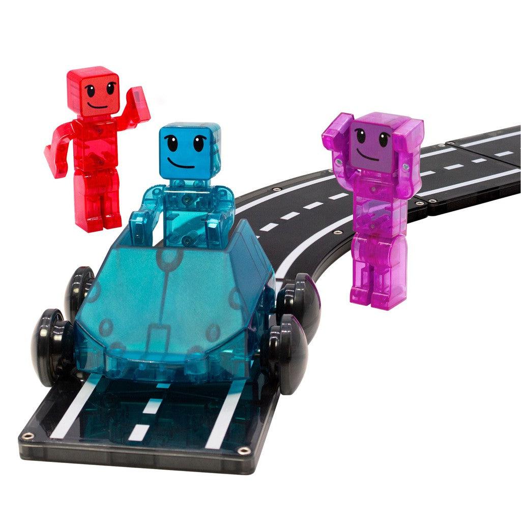 this image shows the blue car on a magna tiles track, speeding by the red and purple people in the box. 