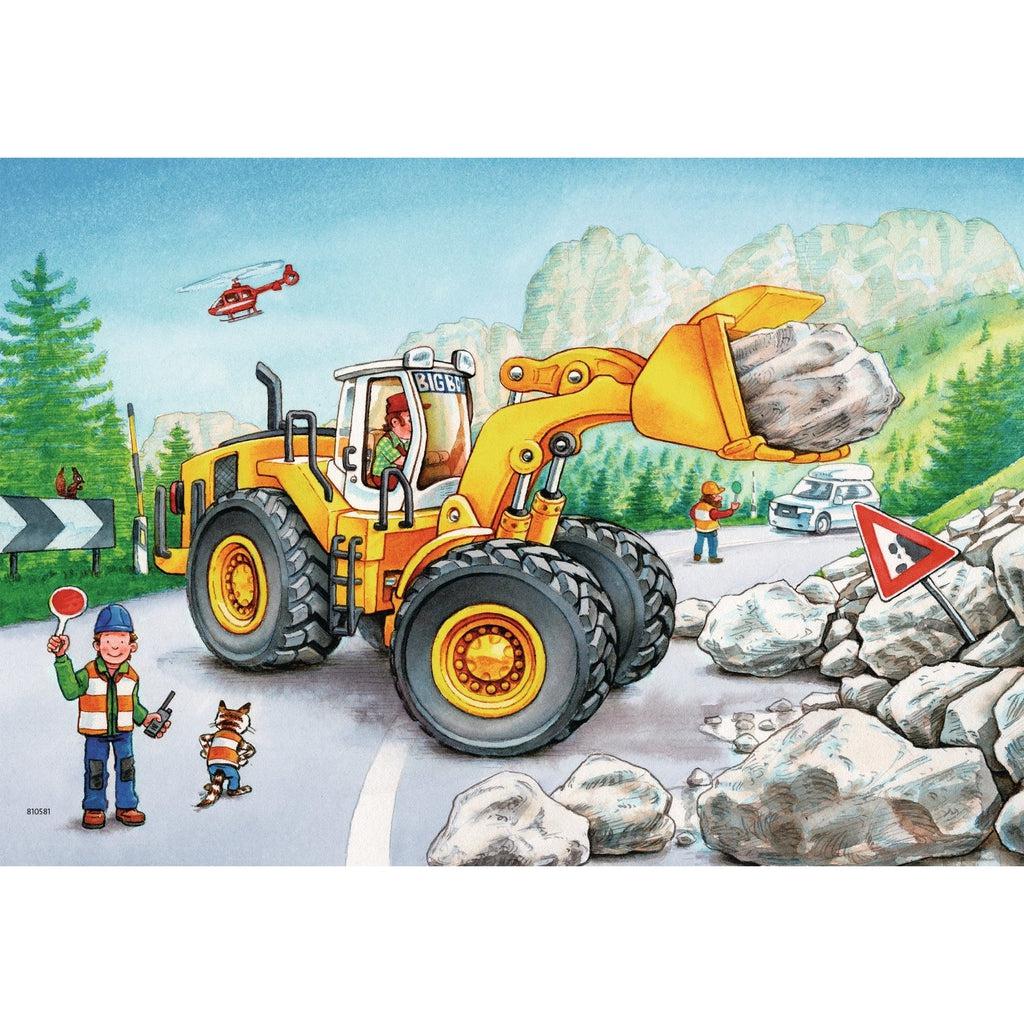 Image of one of the finished puzzles. It is an illustration of a construction vehicle moving rocks off of a road.