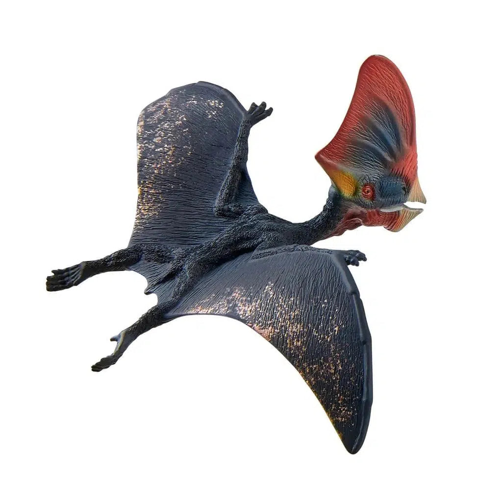 Close up of the dinosaur figure. It is black with wings and a large red fin on its head.
