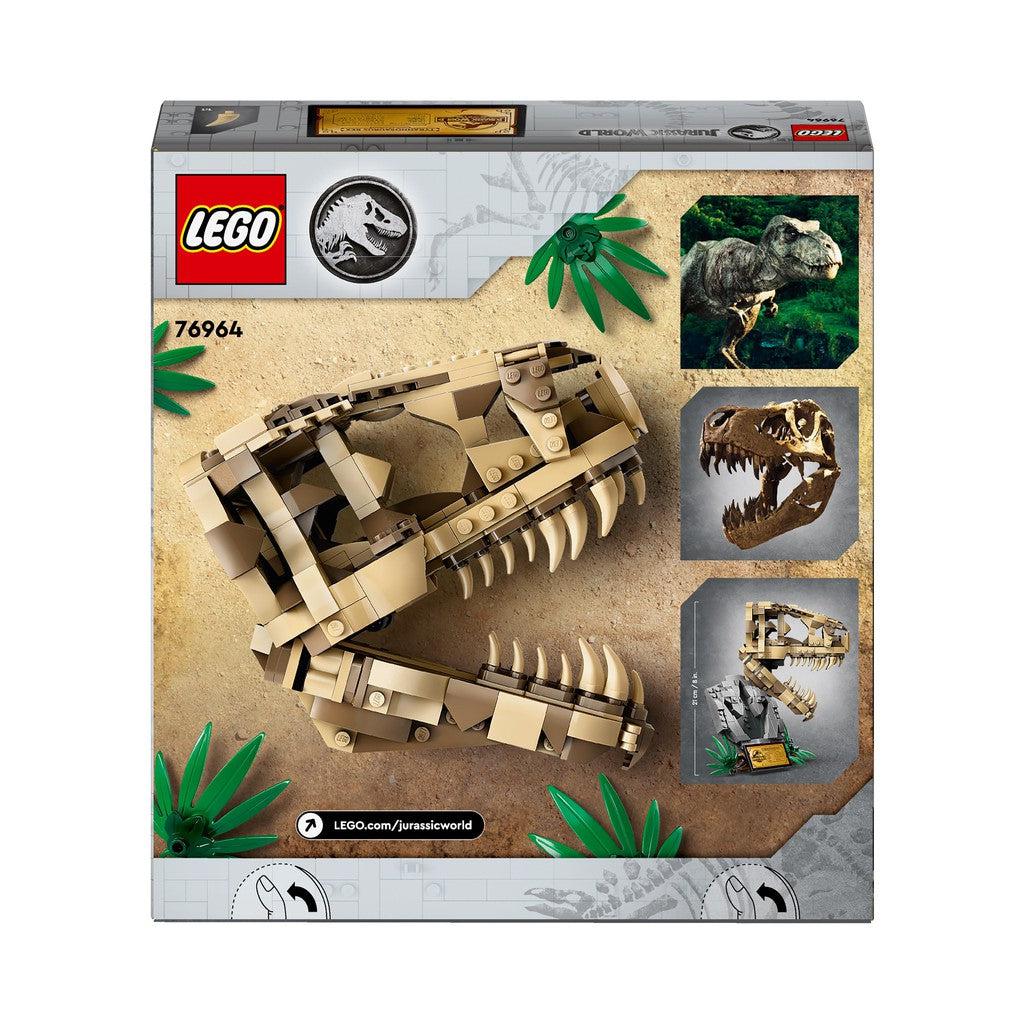 the back of the box shows the skull, plaque, fossil, and an image of a t.rex from Jurassic world