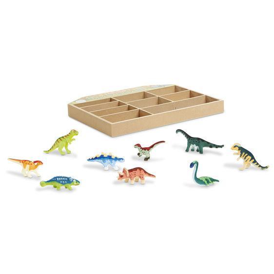 Image of all the dinosaur figurines outside of the packaging. They are each a different color as well as a different shape and size.
