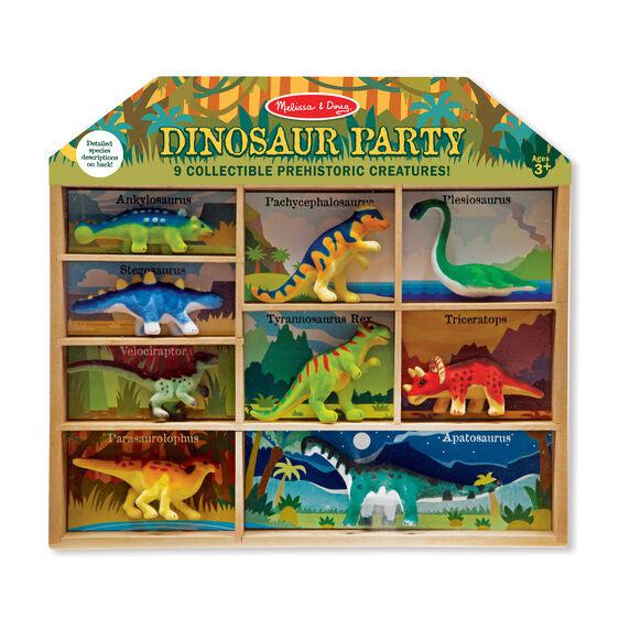 Image of the packaging for the Dinosaur Party figurine set. It comes in a box with separate labeled enclosures for each of the nine included dinosaurs.