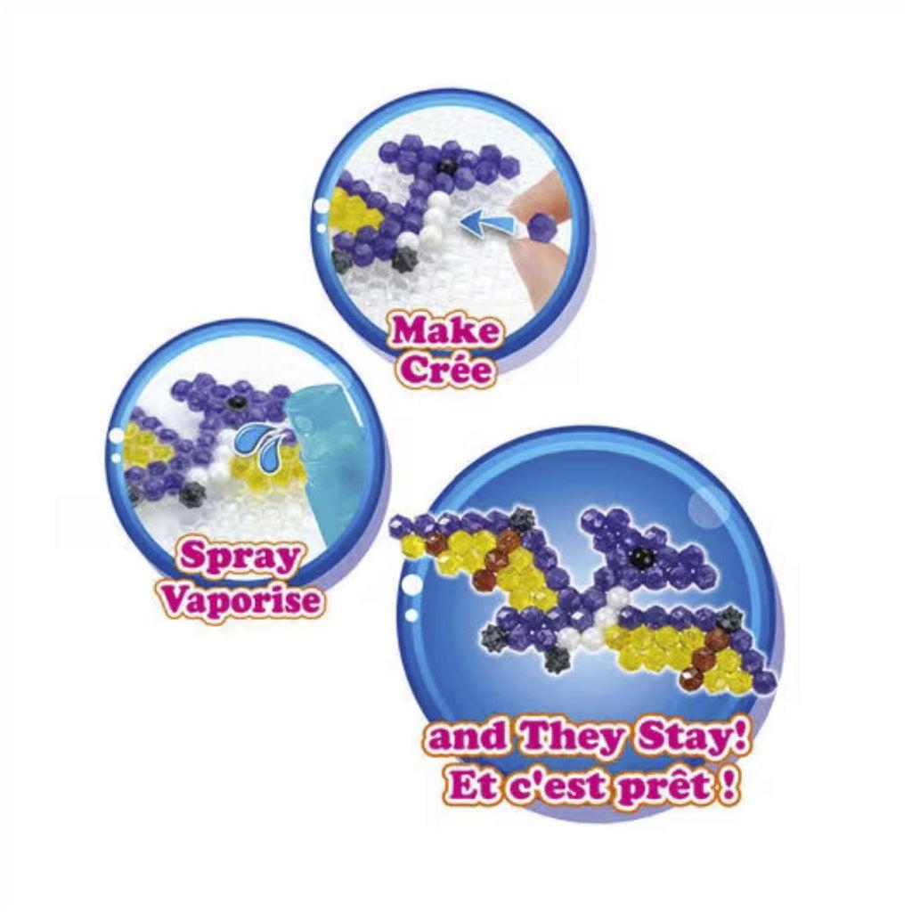 Shows how to create aquabeads creations. 1) Arrange the beads 2) Spray with water 3) Done!