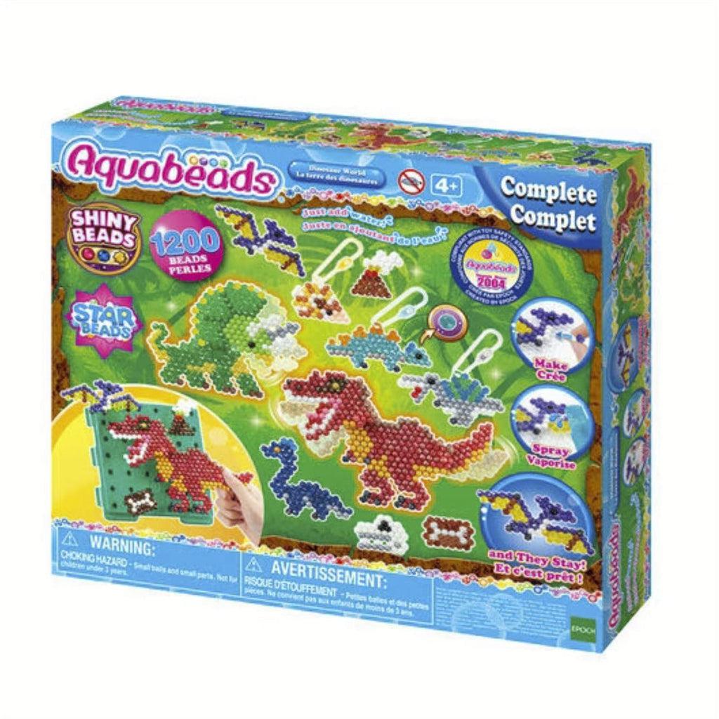 Image of the Dinosaur World aquabeads set. On the front of the box is a picture of possible dinosaur aquabeads creations.
