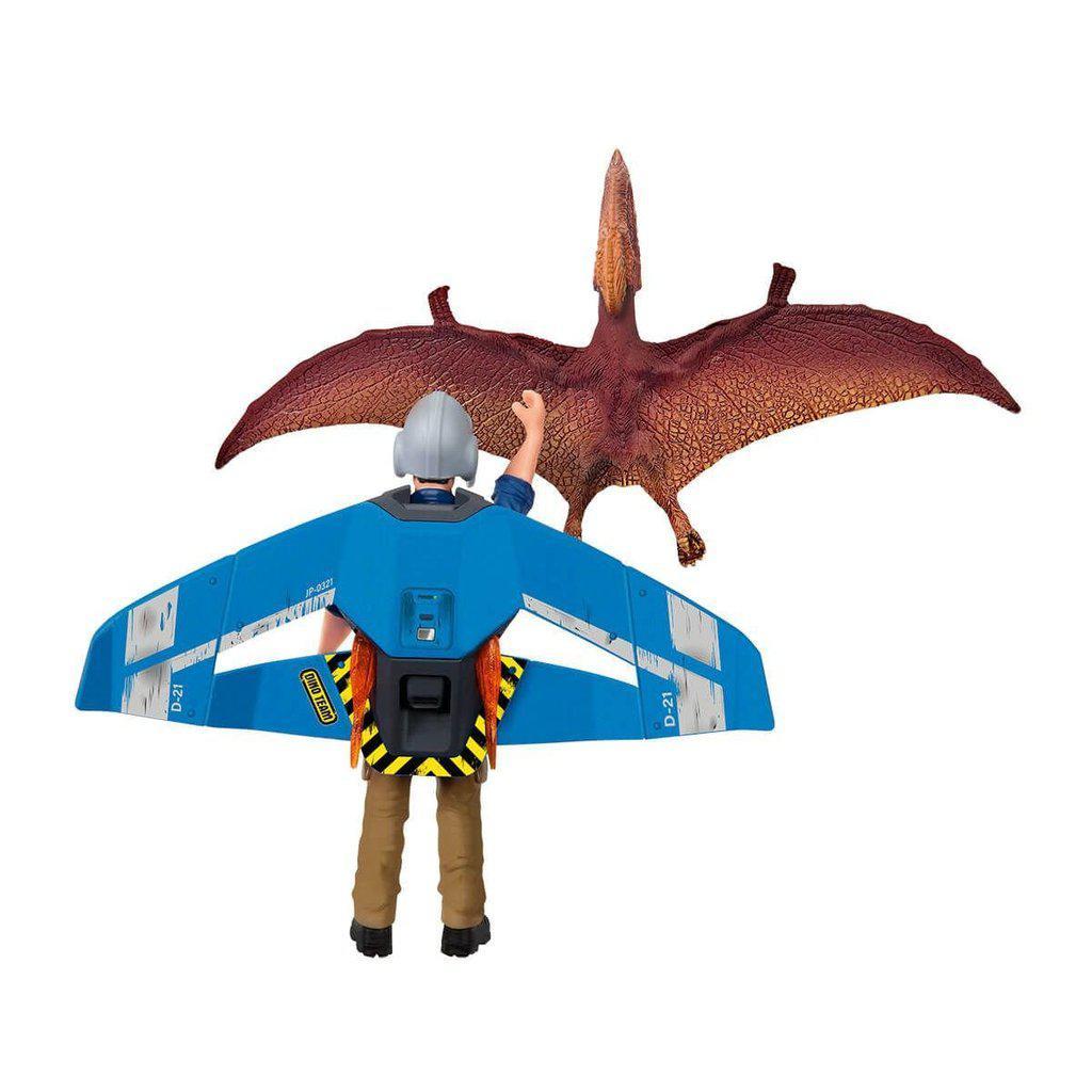 Image of the set outside of the packaging. It comes with a jetpack and rider, a dinosaur, and a loop.