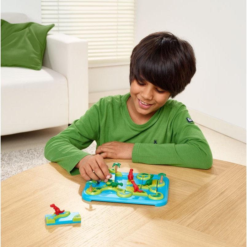image shows a child moving a piece around to find where it goes. 