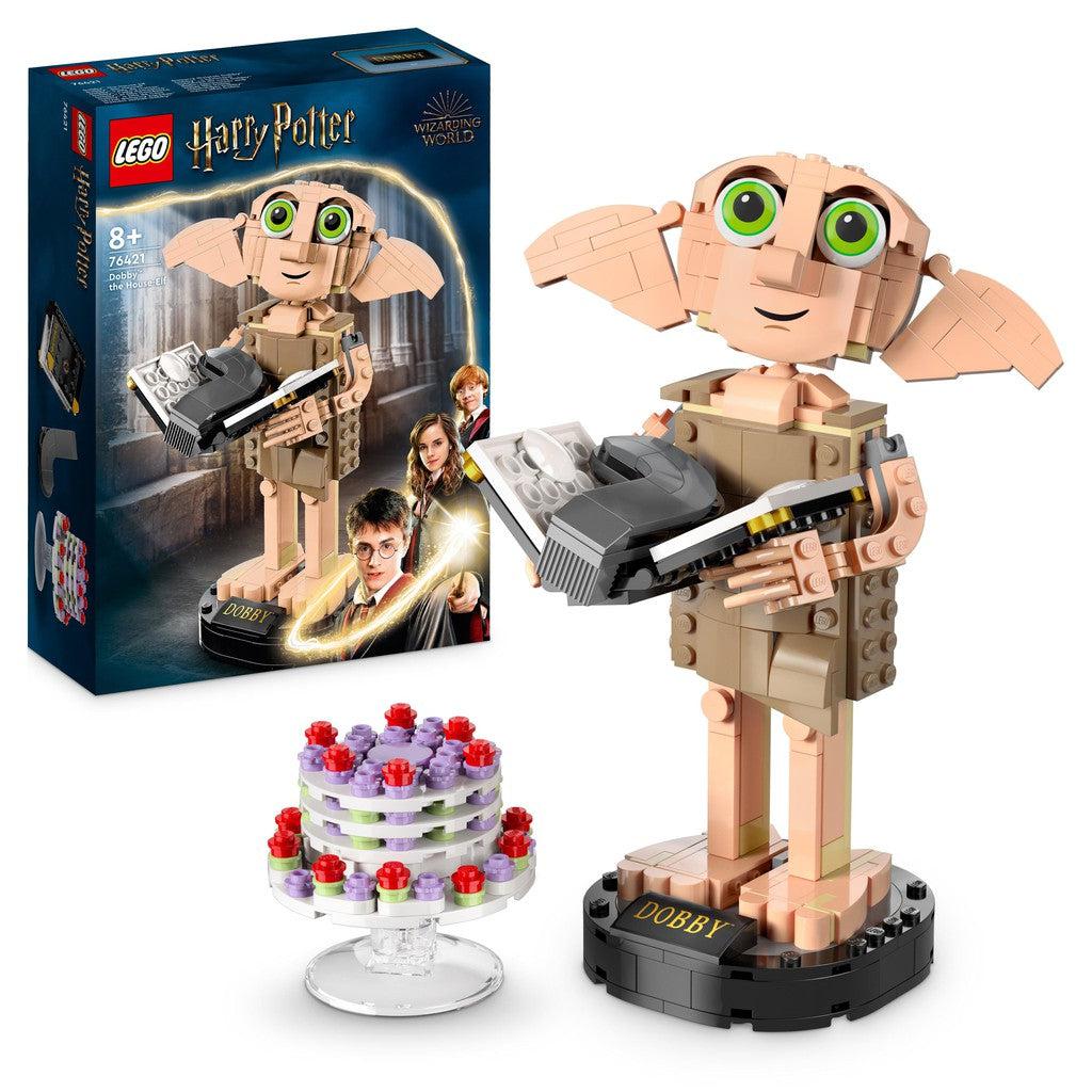 image shows the LEGO Dobby with a cake stand, cake and a book with a sock in it