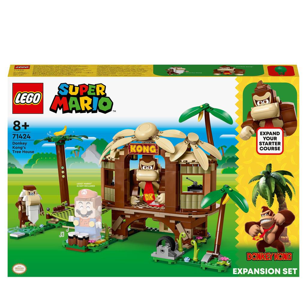 image shows teh LEGO Super Mario Donkey Kong's Tree House. IMage shows Donkey Kong standing in a LEGO tree house with some Jungle Drums outside