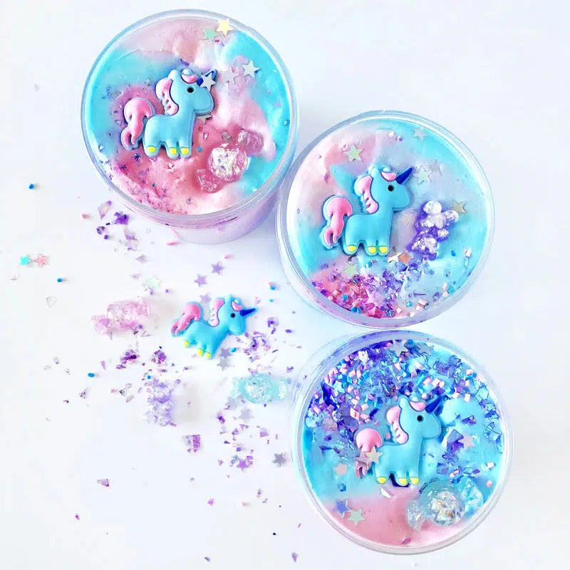 image shows three jars of unicorn kawaii slime that comes with a unicorn and glitter. the slime is pink and blue