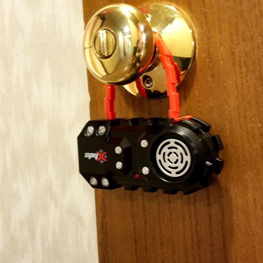 a toy door alarm sensor from the SpyX brand, it hands on the doorknob