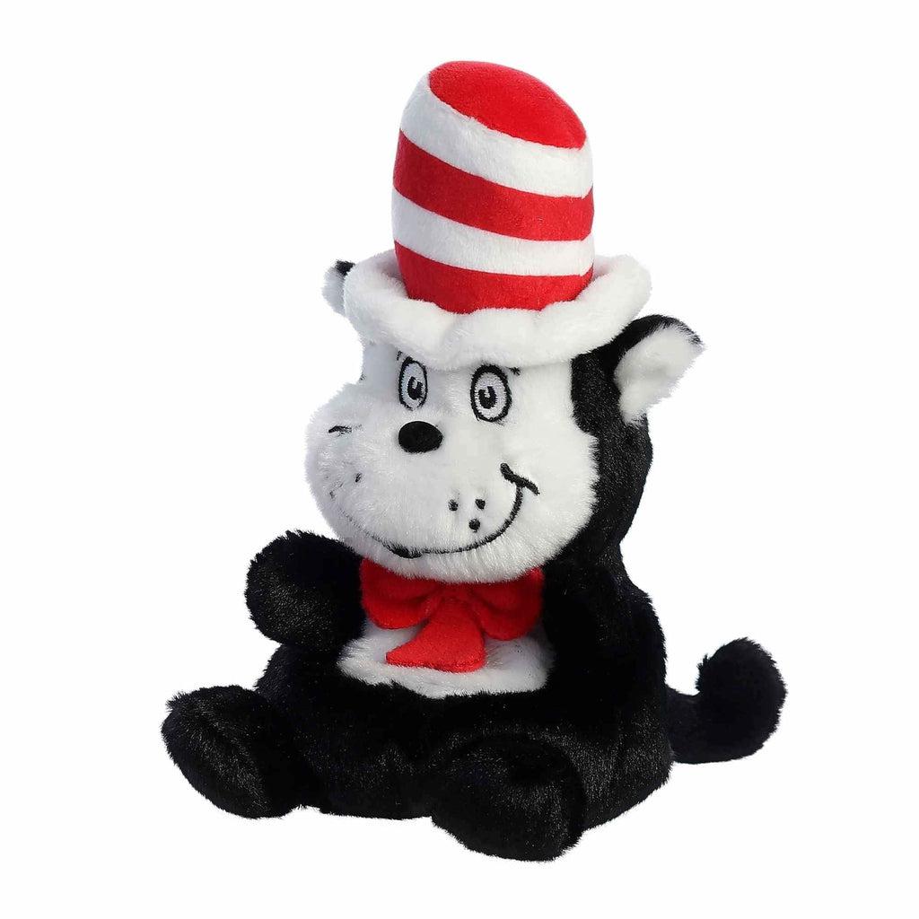 Image of the Dr. Seuss Cat in the Hat Palm Pal plush. It is a black and white sitting cat with a wide smiling face. He also has a red bow around his neck and a white and red striped hat.