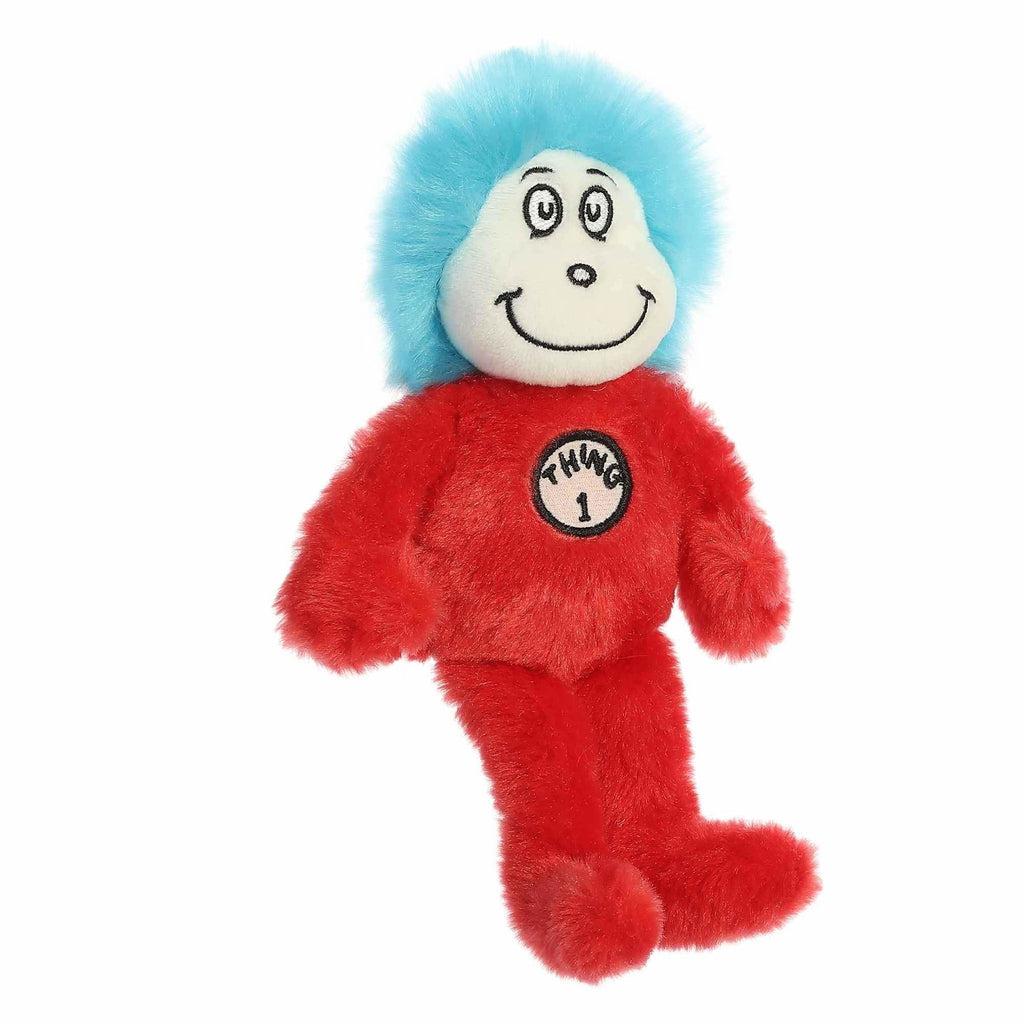 Image of the Dr. Seuss Thing 1 plush. It has a red body, a white face, and electric blue hair. There is a sign on their chest saying "Thing 1"