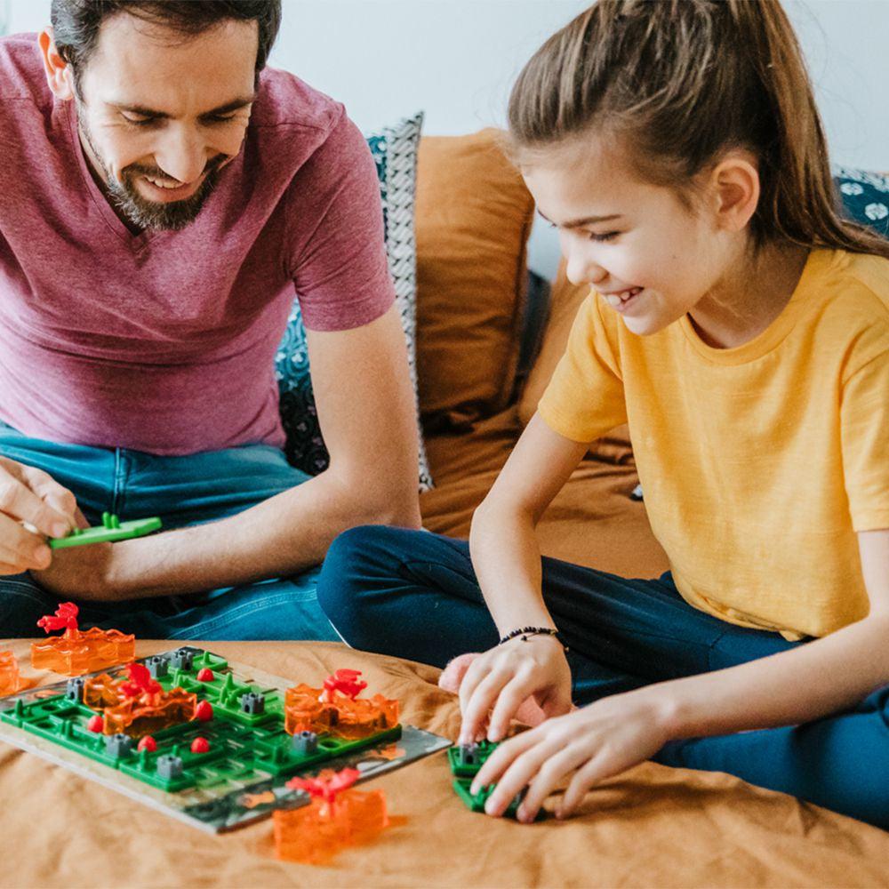 Scene of a dad and daughter playing the game together.