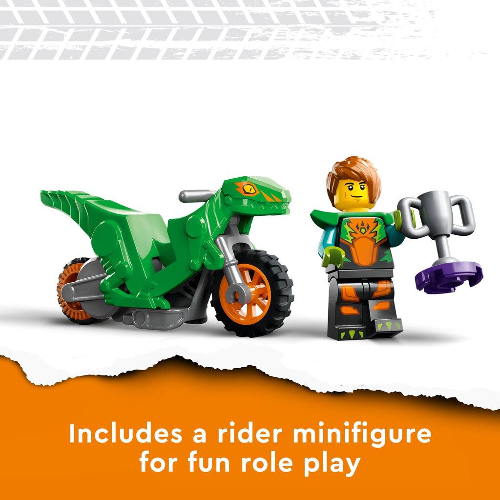 Close up of the included minifigure. He is wearing a dinosaur themed stunt outfit and is holding a prize cup. Caption: Includes a rider minifigure for fun role play