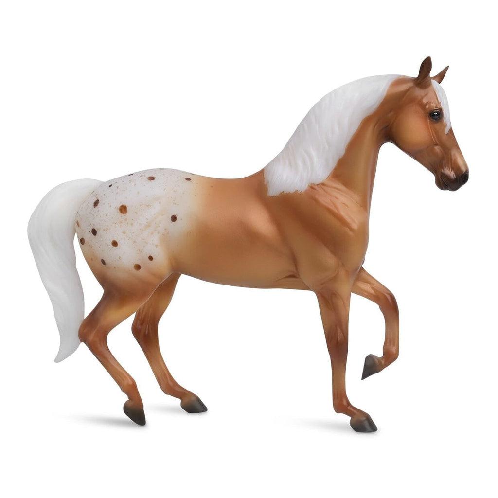Image of the mom horse figurine. it is a sienna horse with a large white spot on its flank and stark white hair for its mane and tail.