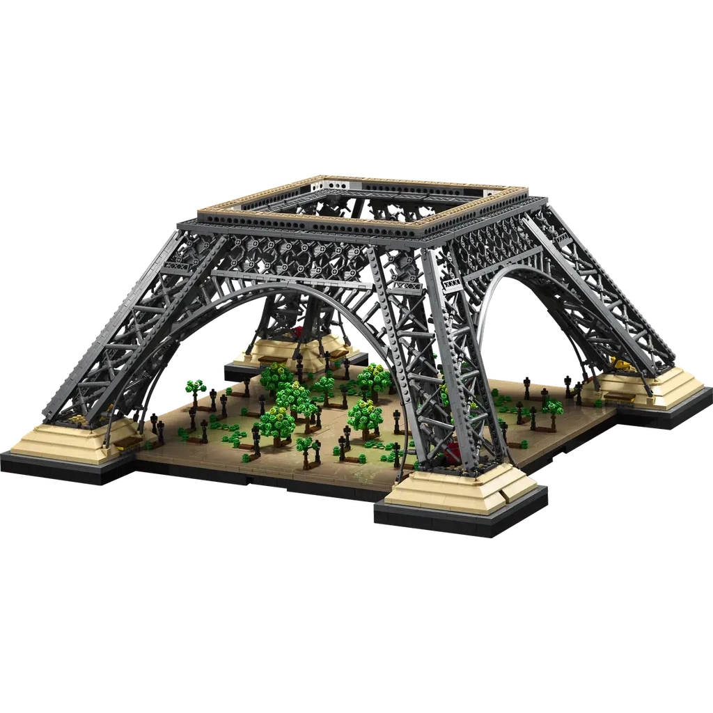 The base of the tower is shown, It consists of just the bottom of the 4 tower legs up to the first support bridges. Below the legs there is a park full of lego trees