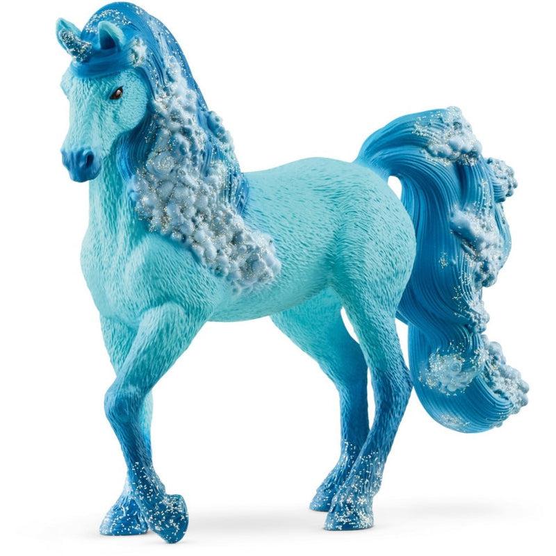 Image of the Elementa Water Unicorn Mare figurine. It is a light blue horse with darker blue hair that has sea foam throughout the locks. The hooves have a dark blue fade and the horn is glittery.