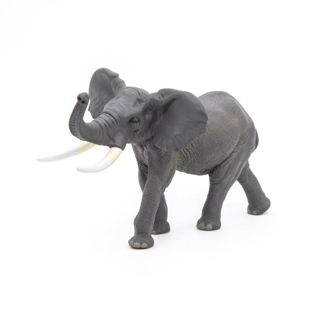 Image of the Elephant figurine. It is a grey elephant with long white tusks and a trunk that curves up.