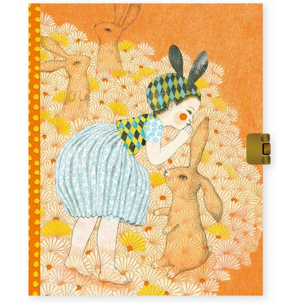 Image of the Elodie Secrets Journal. On the front is a little girl wearing bunny ears talking to three rabbits.