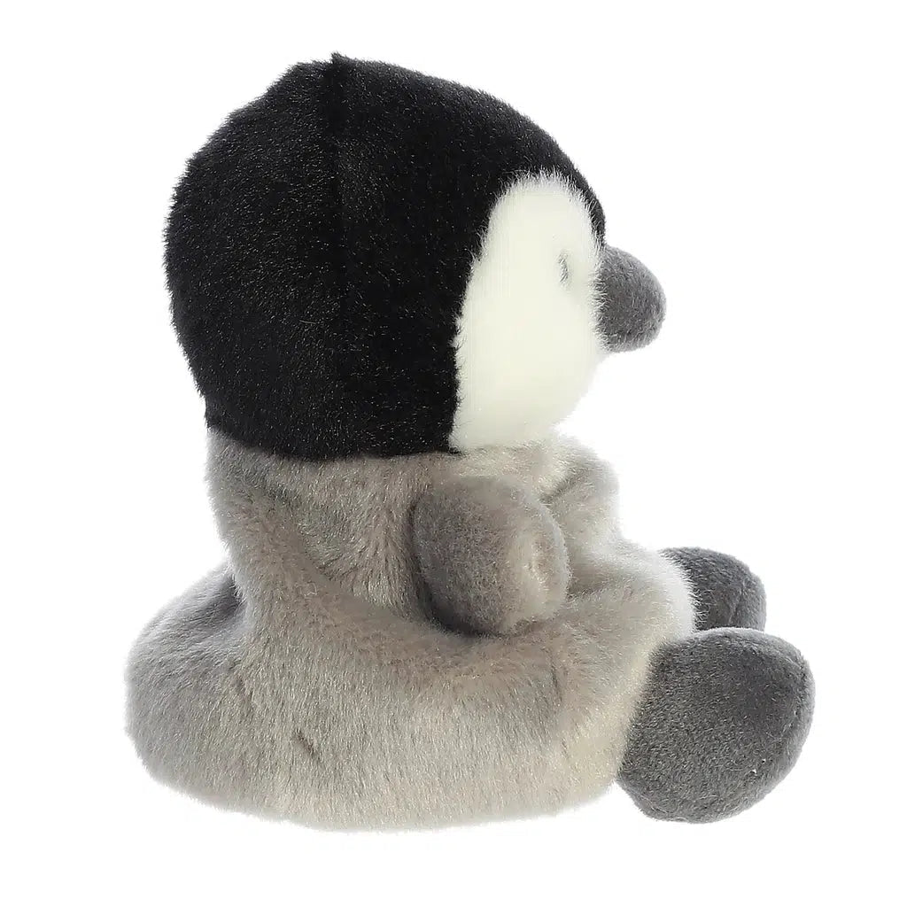 Side view of the penguin plush. From this angle you can see that there is more fabric in the back to create a sleek tail.