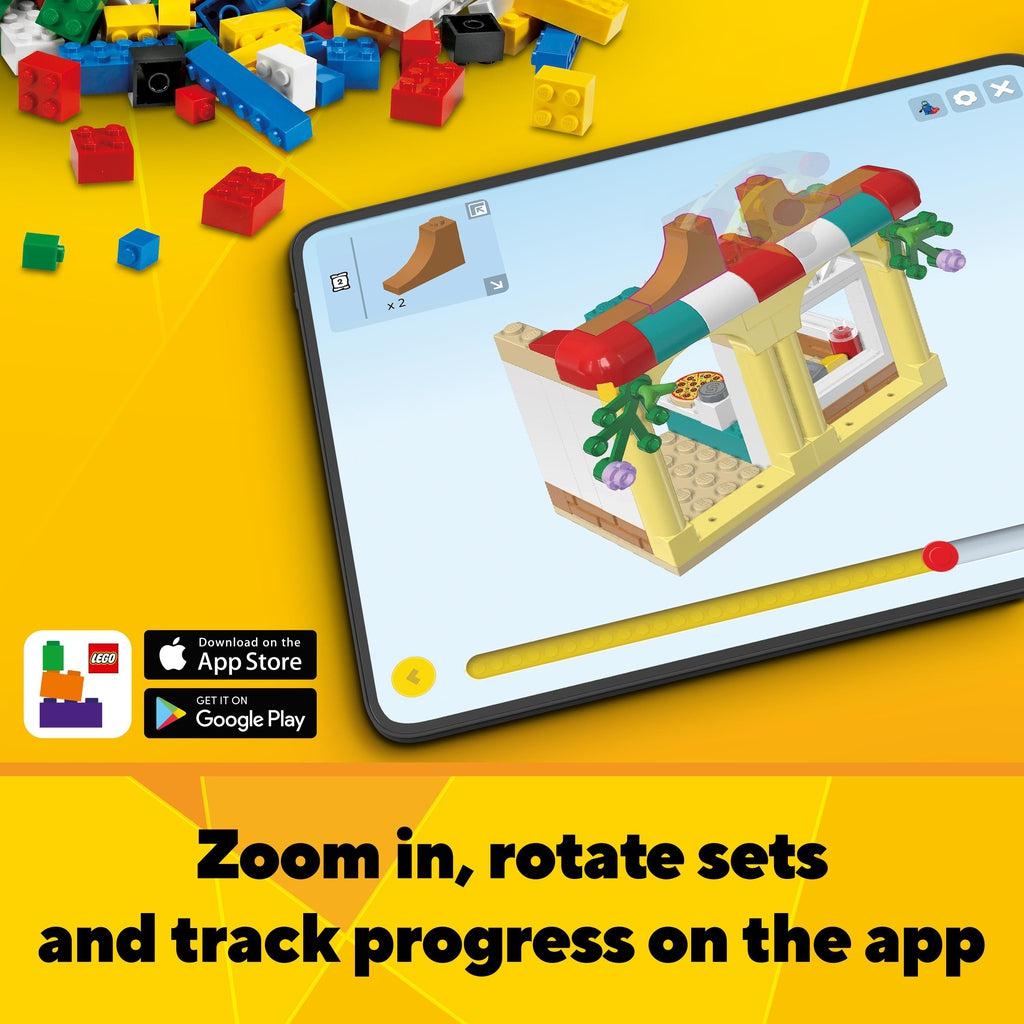 Shows that you can download an Interactive Building app for Apple or Android. Caption: Zoom in, rotate sets and track progress on the app.