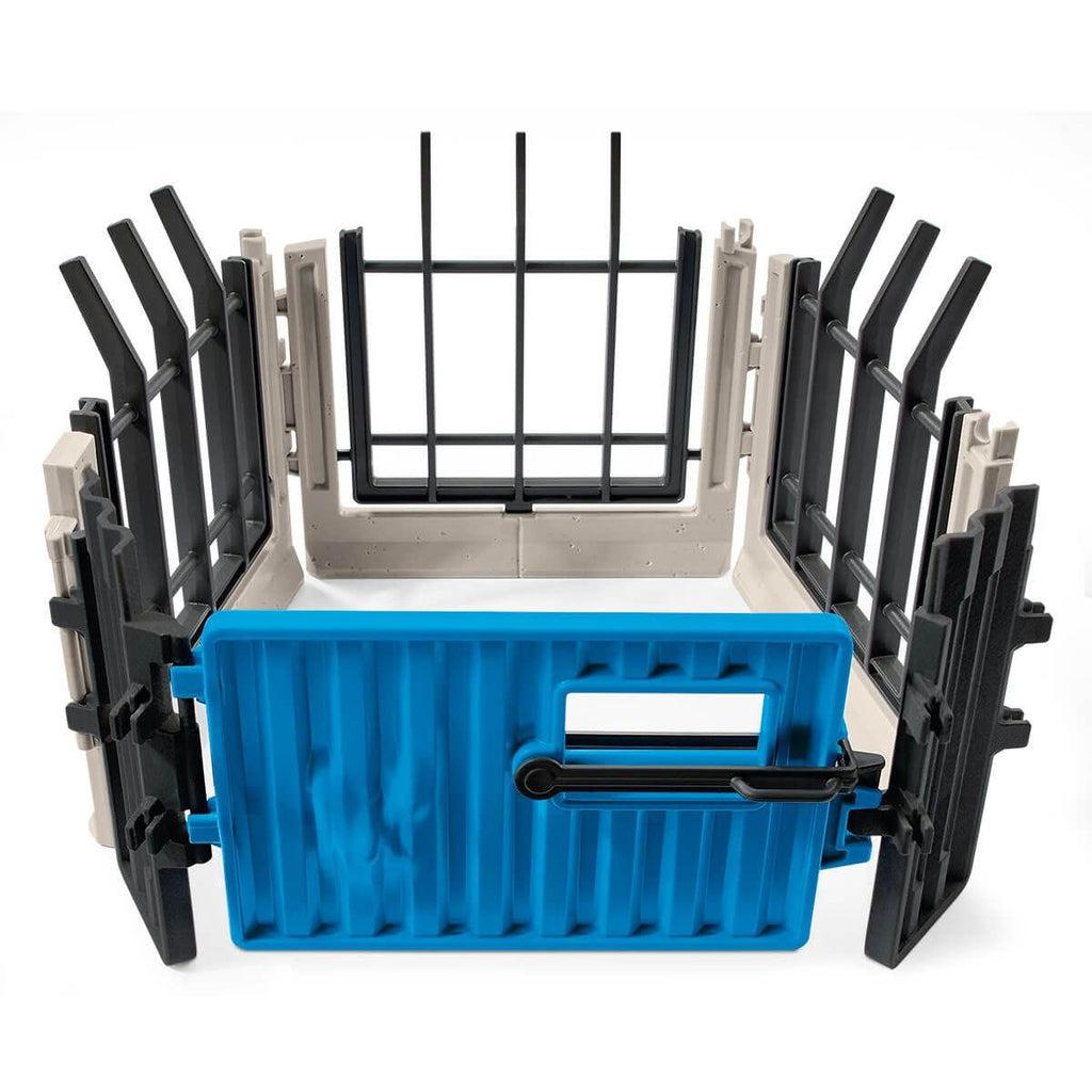 Image of the play set outside of the packaging. It comes with a small fence extension. It is grey, black, and blue.