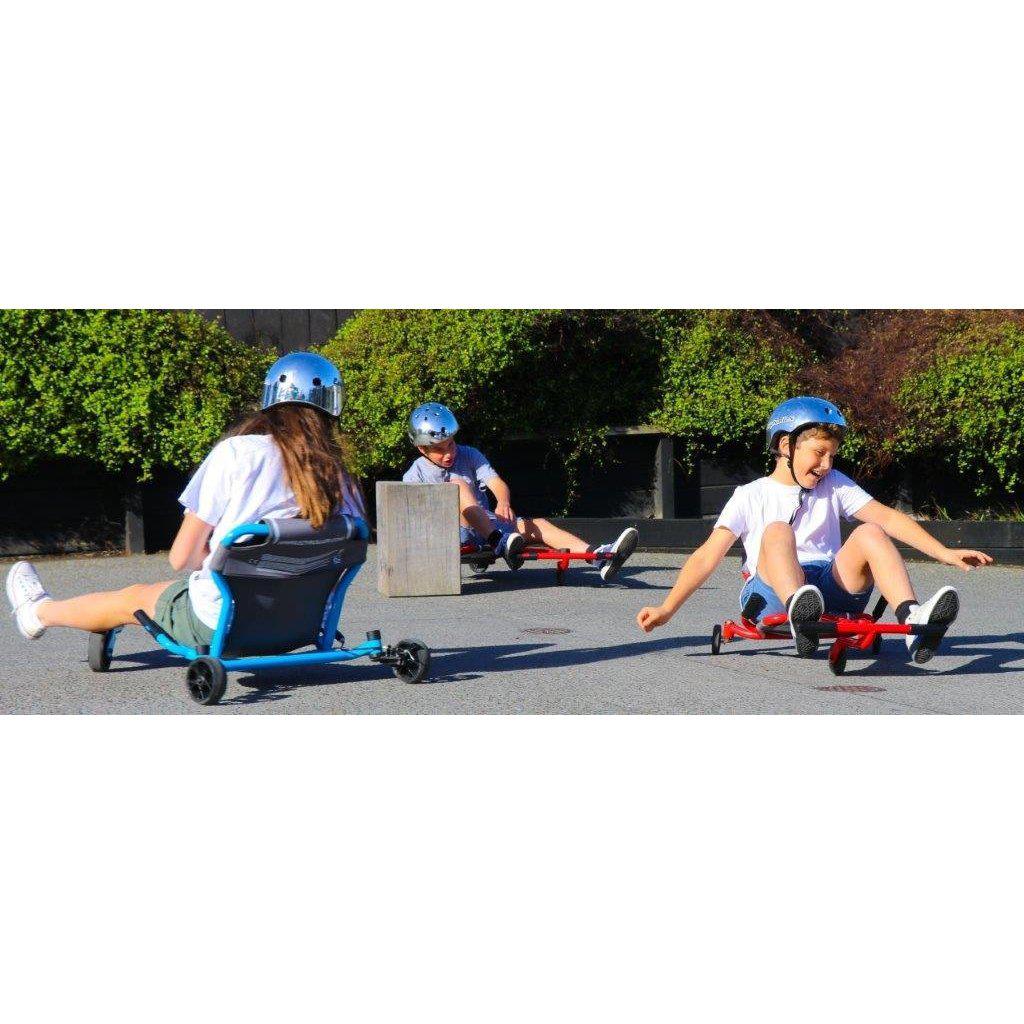more kids playing on rollers, wiggling the roller with the feet pedals and wearing helmets for safety