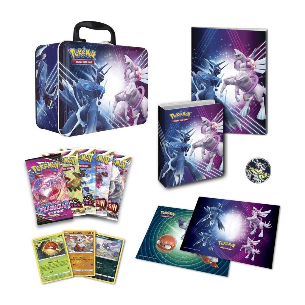 Image of all of the included items in the collector chest. It comes with packs of cards, playing mats, and a collectors pin.