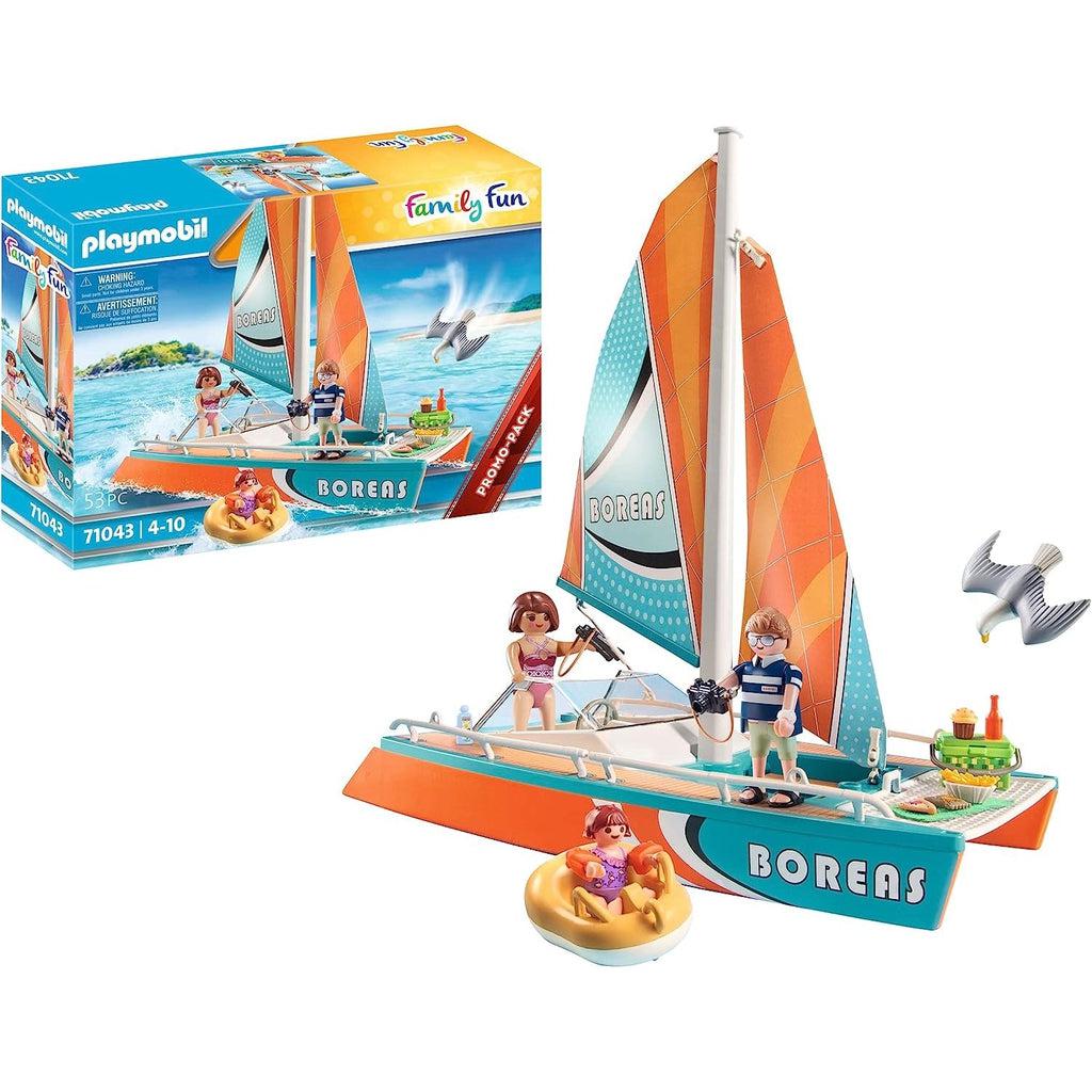 The box is in the background with the toy taking the front in this picture, showing the boat, raft, family and seagull. 