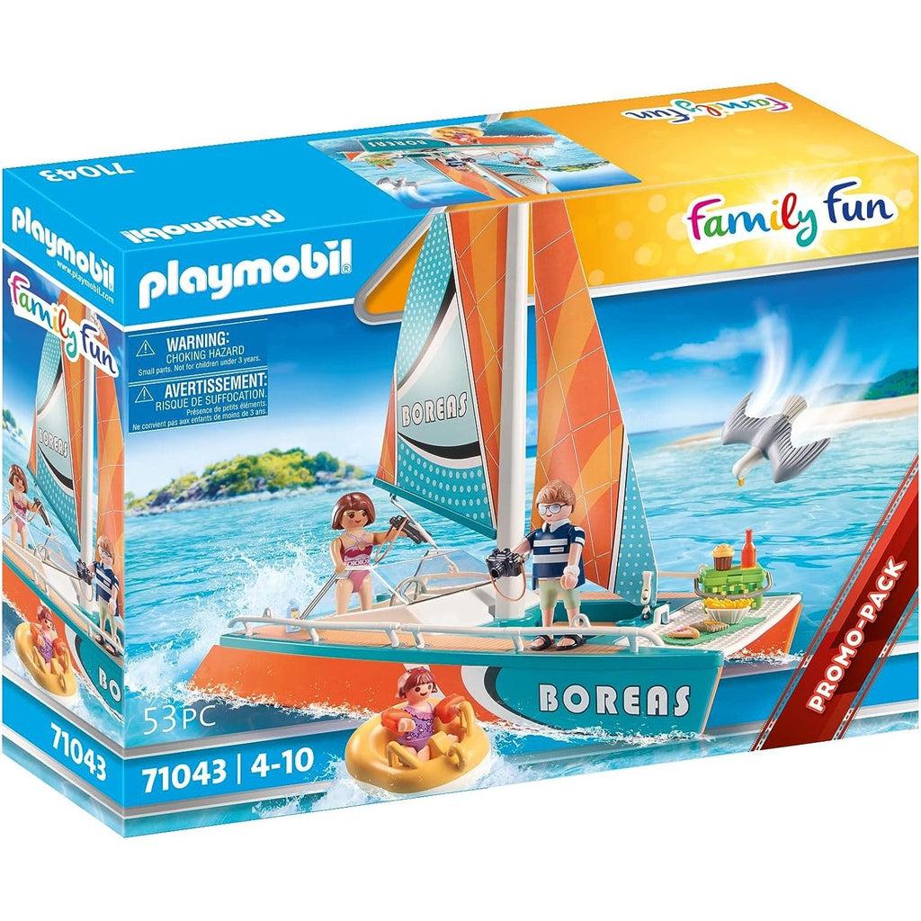 Box cover for the playmobil Family Fun Catamaran. a family is out boating  and a girl is on a raft. 