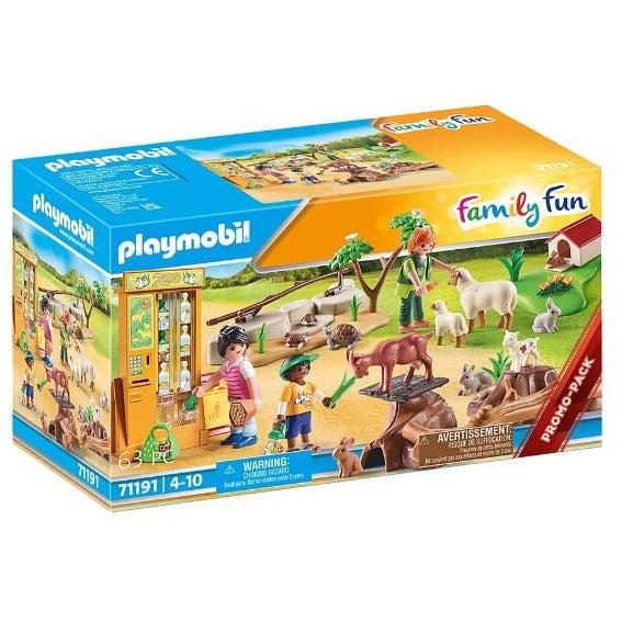 This picture shows teh box for the petting zoo set. there is a family inside the petting zoo with a zookeeper, having a lovely day with the sheep, goats rabbits, and much more!