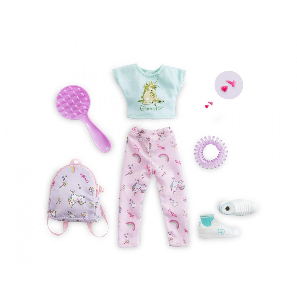 Image of the included pieces. The set includes a light blue unicorn shirt, rainbow and unicorn pajama pants, a unicorn backpack, a hairbrush, a plastic scrunchie, white shoes, and pink heart-shaped earrings.