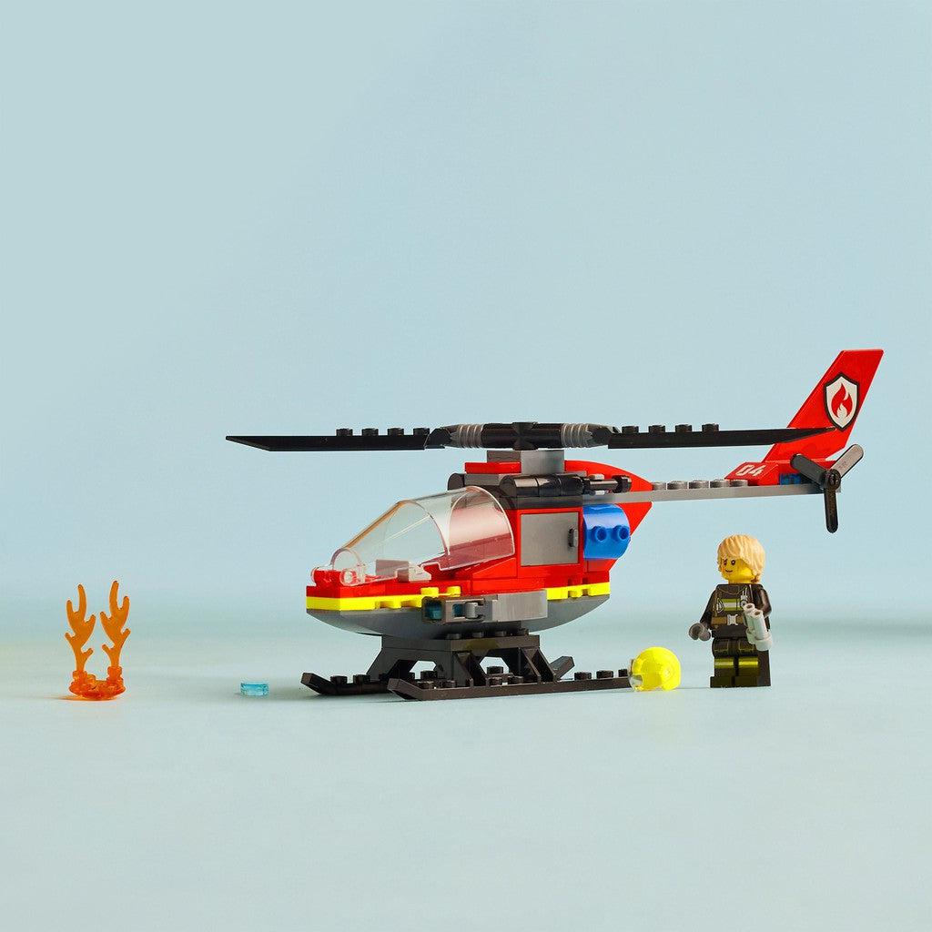 image shows the pilot, fire, helmet, binoculars and helicopter