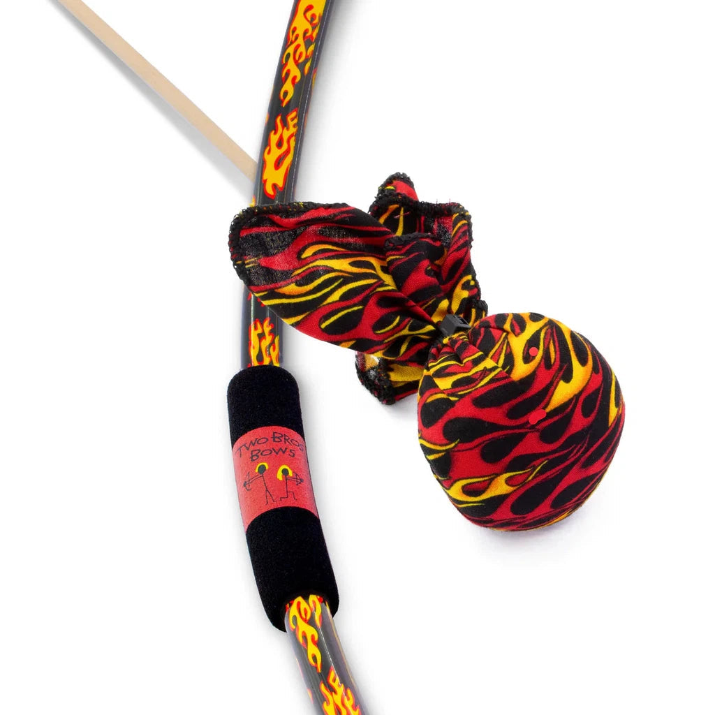 a black bow with flames all over and a foam grip next to an arrow with a large soft rounded flame patterned tip