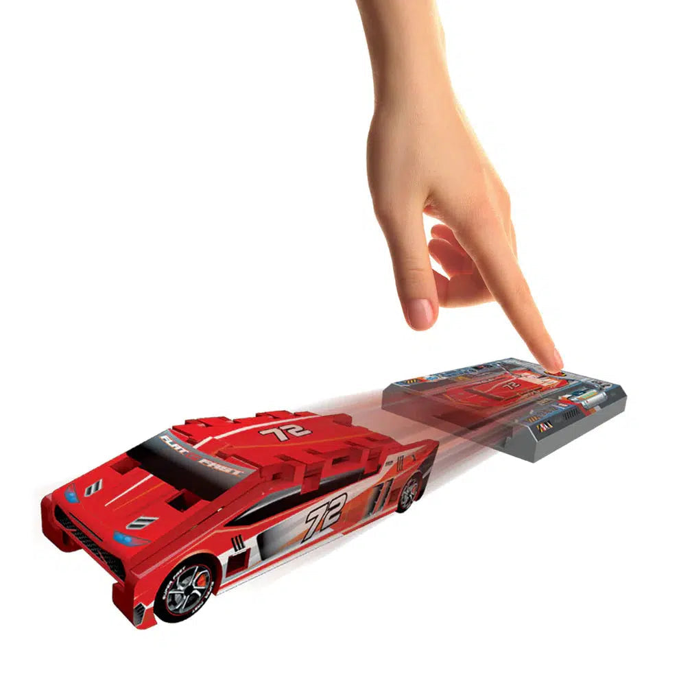  press the launcher button on a Flat 2 Fast™ Card Racer toy racing car as if to propel it forward.