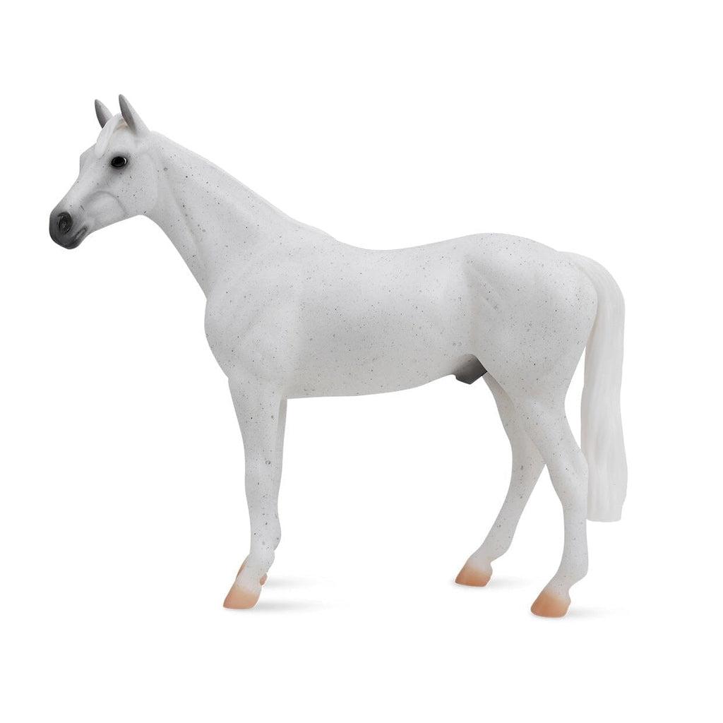 Image of the Fleabitten Grey Throroughbred figurine. It is a completely white horse with tiny tiny black spots everywhere.