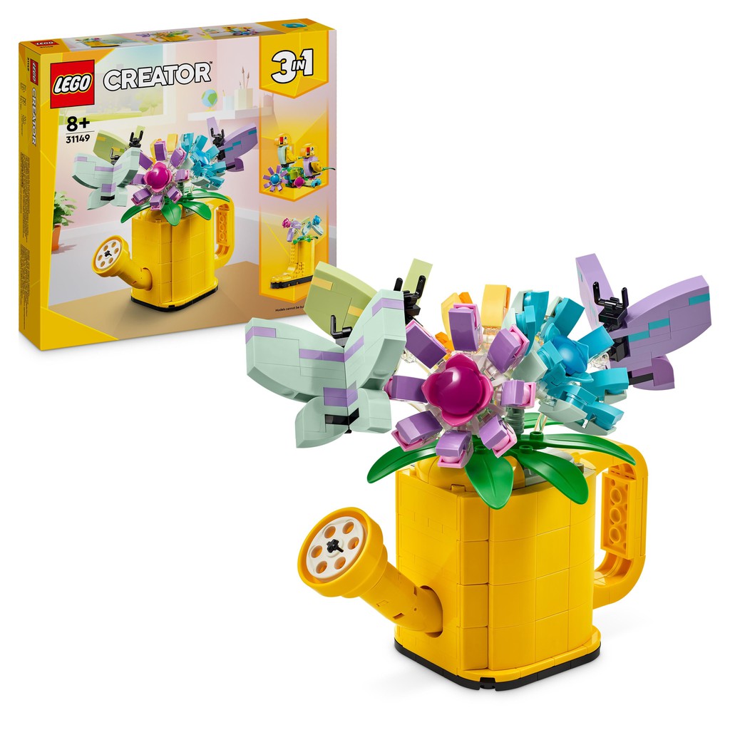 the LEGO creator 3 in 1 flowers in a watering can. the can is a vibrant yellow accompanied with blue and purple LEGO flowers