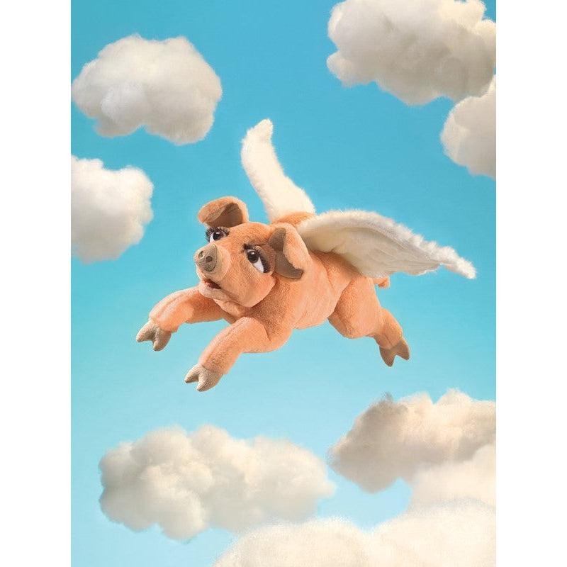 Puppet edited into a scene flying through a blue sky with clouds.