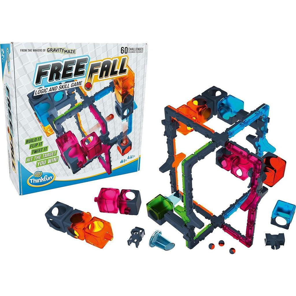 this image shows a picture of Free fall, a logic ans skill game. the box says "Build it, flip it, twist it, Hit the target you win" the game looks like a collections of building towers to make a marble gravity maze using logic and skill to complete the challenge. 