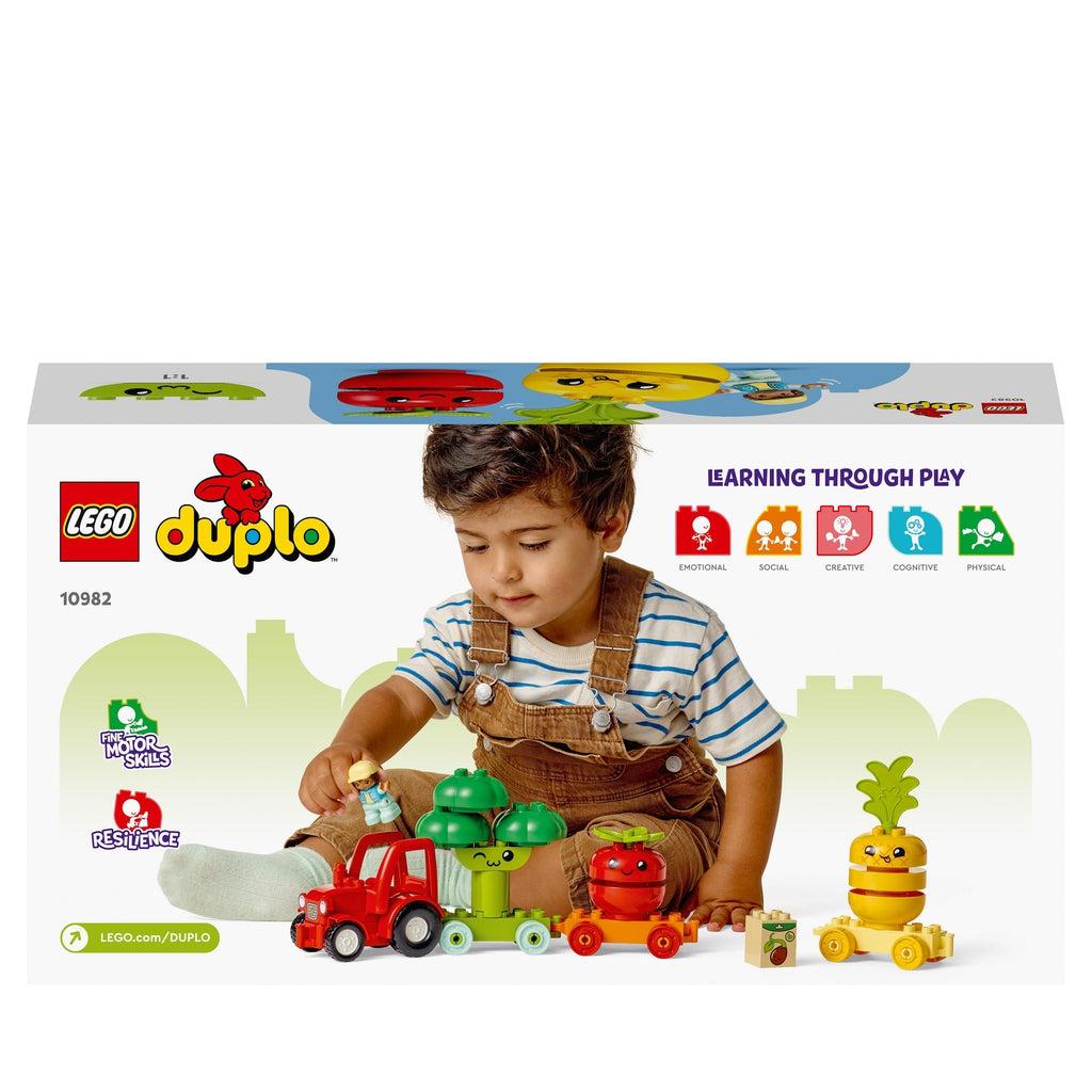 Image of the back of the box. It is a scene of a little boy playing with the Lego set. Shows that he is developing motor skills and resillence.
