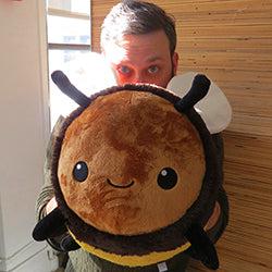Person holding bee plush